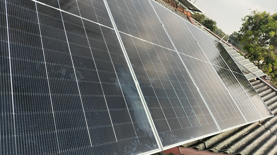Solar panel rooftop installation on a residential home in Ja-ela, featuring distributed photovoltaic modules mounted on the roof structure for clean energy generation